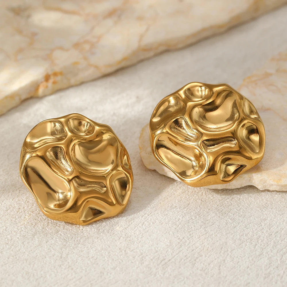 statement stud earrings for women, textured gold earrings, modern gold stud earrings, Textured metal statement stud earrings in gold, bold abstract design with high-shine finish, contemporary women’s fashion jewelry for workwear and special occasions.