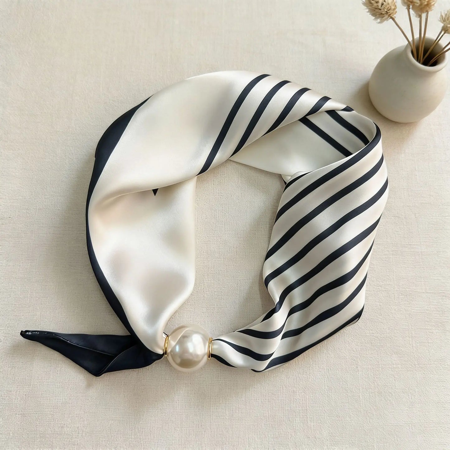 Women's printed faux silk neck scarf with a magnetic pearl closure, featuring a smooth silk-feel finish and elegant floral print for a polished everyday fashion accessory.