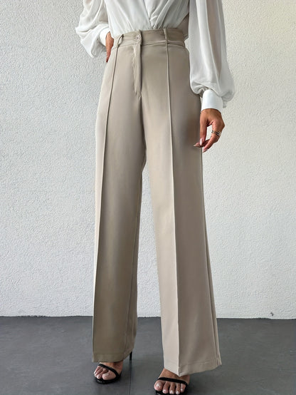 French minimalist column pants, wide-leg high waist trousers for women, versatile work to evening outfit, travel-ready neutral beige office look.