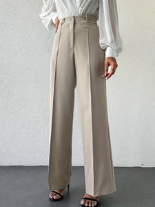 French minimalist column pants, wide-leg high waist trousers for women, versatile work to evening outfit, travel-ready neutral beige office look.
