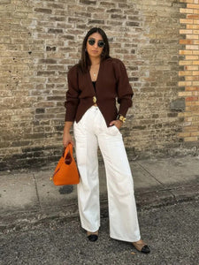 Classic women’s knit cardigan with modern twist statement button front, deep V neckline, cinched waist, and elegant fall tones for timeless, fashion-forward cold-weather outfits.