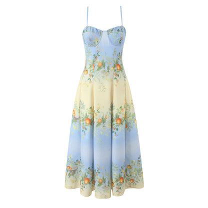 Botanical corset midi dress with a sweetheart neckline, blue-to-ivory ombré floral print, structured bodice, and flowing fit-and-flare midi skirt.
