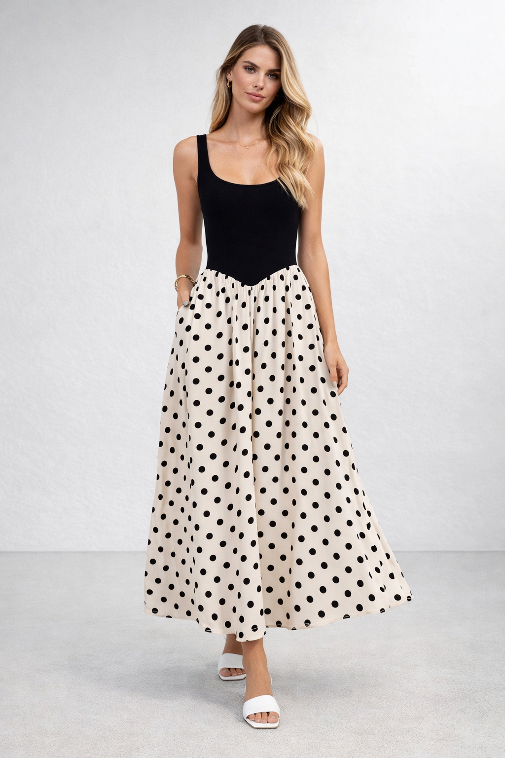 vintage polka dot maxi 2026, colorblock maxi dress, summer color block dress, quiet luxury polka dots, Sleeveless polka dot contrast dress with structured bodice trend and gathered full skirt silhouette, black bodice polka dot maxi for wedding guest polka dot dress or work-appropriate polka dot maxi styling.
