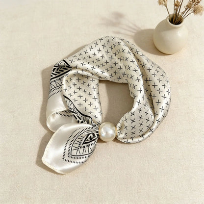 Lightweight faux silk fashion scarf with a decorative floral print and magnetic pearl clasp, designed for women seeking versatile neck accessories for work, travel, and everyday outfits.