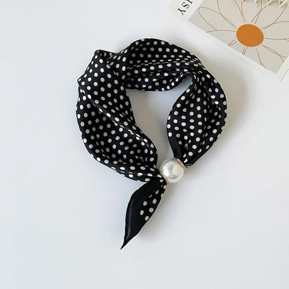 Printed silk-feel neck scarf with an elegant magnetic pearl closure, floral pattern, smooth drape, and lightweight design for sophisticated everyday styling.