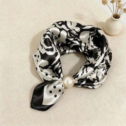 Printed faux silk scarf for women with a magnetic pearl clasp and satin-look finish, designed as a lightweight neck scarf that instantly elevates workwear and smart casual outfits.