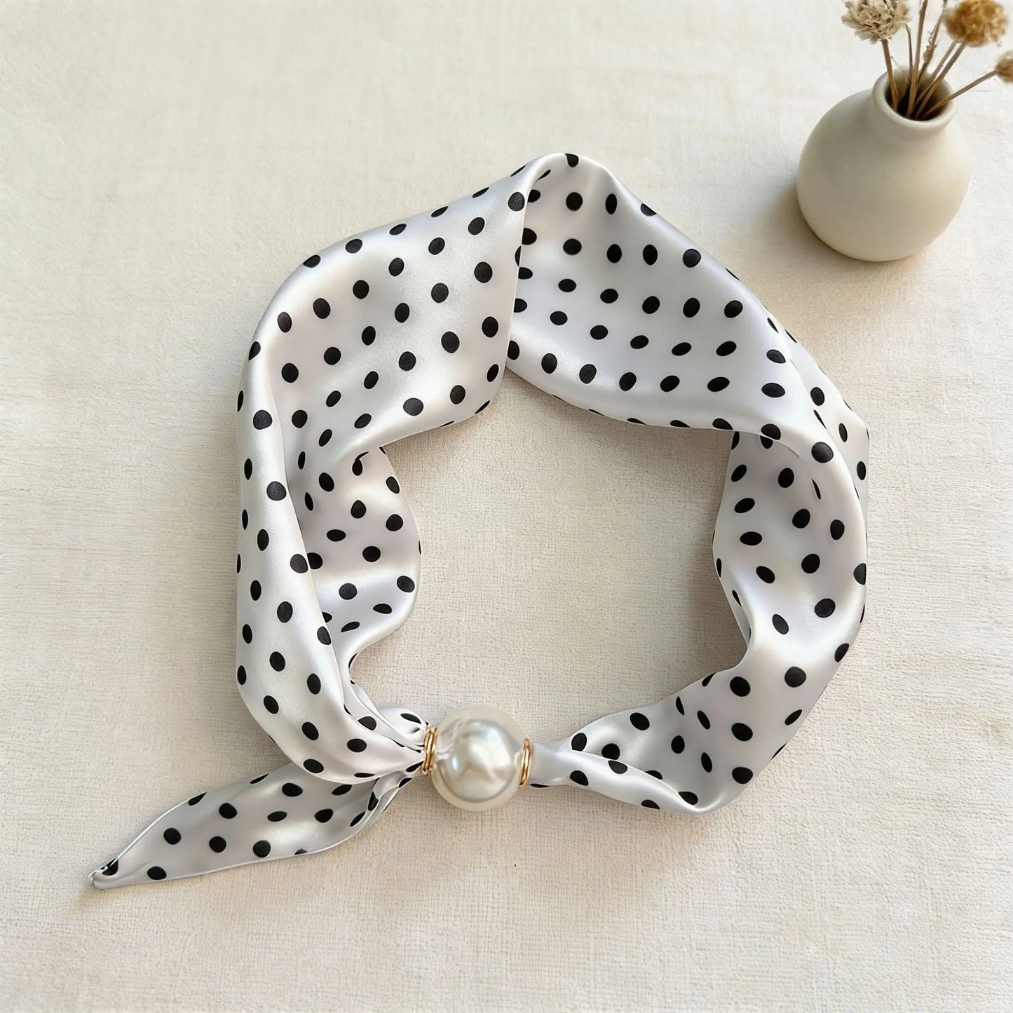 Women's printed faux silk scarf necklace with a magnetic pearl closure, lightweight silk-feel fabric, and decorative floral print for refined everyday styling, gifting, and modern fashion wardrobes.