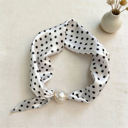Women's printed faux silk scarf necklace with a magnetic pearl closure, lightweight silk-feel fabric, and decorative floral print for refined everyday styling, gifting, and modern fashion wardrobes.