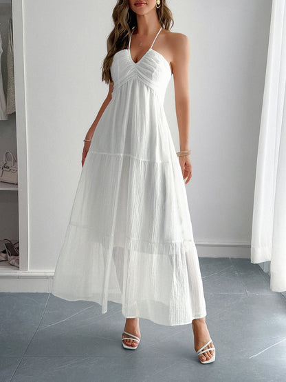 ruffled tier detail on a white color boho halter maxi dress in lightweight cotton – summer vacation style.