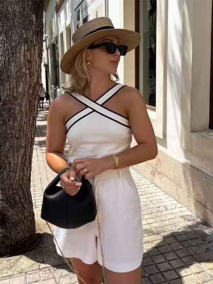Minimalist white ribbed tank top with black trim, travel-ready and perfect for summer-to-fall layering. layering tank top, white ribbed tank top, halter tank top.