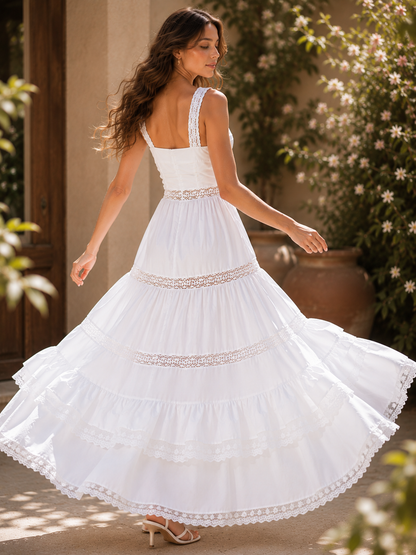white ruffle maxi dress featuring a square neckline, lace shoulder straps, tiered skirt, fabric-covered buttons, and elegant lace detailing, styled as a summer white dress for vacations, bridal showers, resort dinners, and coastal holidays.