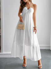 Load image into Gallery viewer, Woman in a white colored ruffle tiered maxi dress posing for a photo  dreamy vacation outfit vibe.