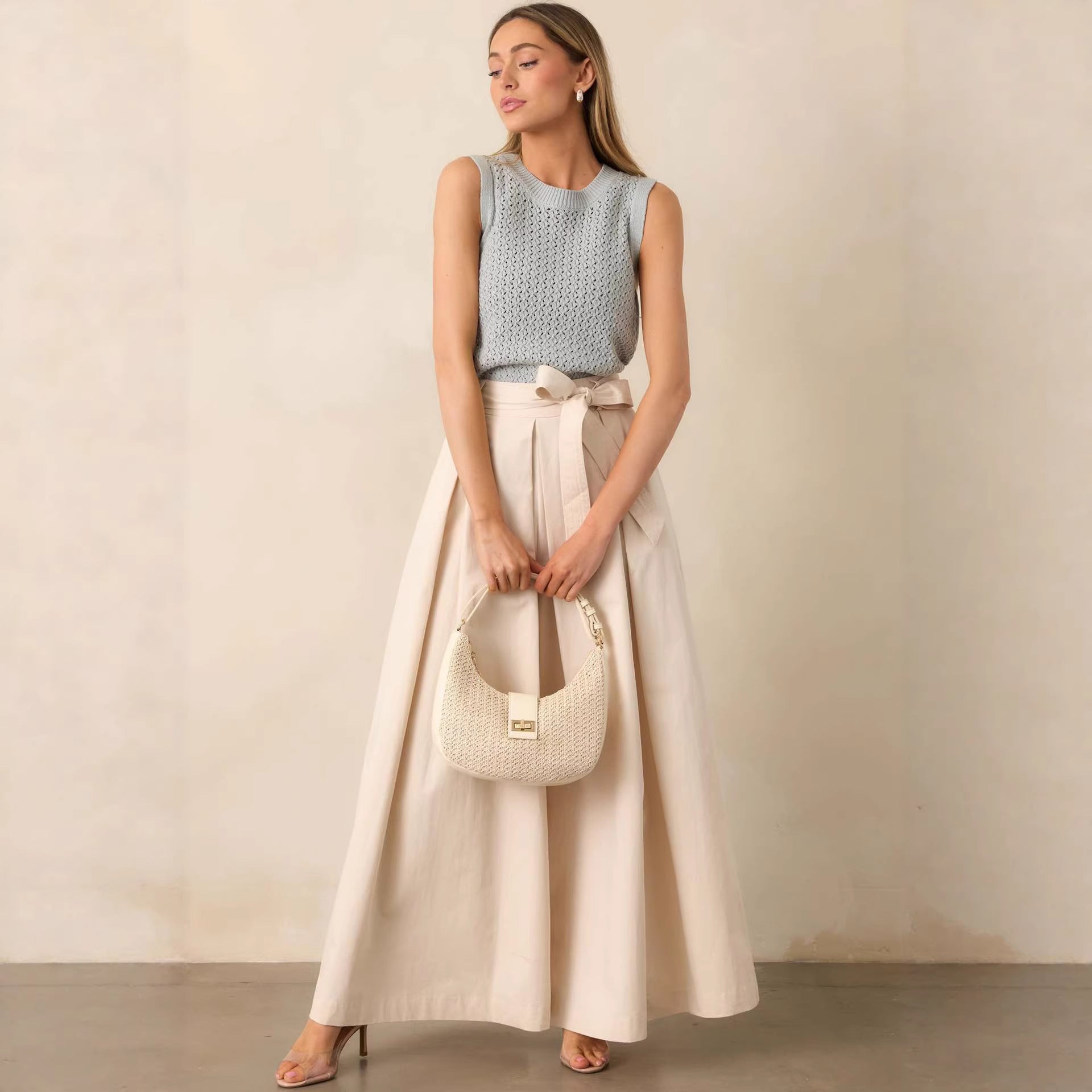 neutral outfit pants women, wide leg pants outfit business casual, High waisted cream wide leg trousers, soft structured texture with tie belt waist and pleated front detail, relaxed wide leg silhouette, wide leg pants work outfit women, ideal for office wear styling, high waisted wide leg pants work outfit.