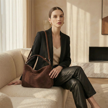 Load image into Gallery viewer, women,s black suede handbag, workwear handbag women, minimalist handbag, Everyday suede handbag with hobo silhouette, subtle hardware, and spacious interior, styled for quiet luxury looks, office wear, and casual city outfits, convertible crossbody bag, fall handbags, slouchy tote bag.
