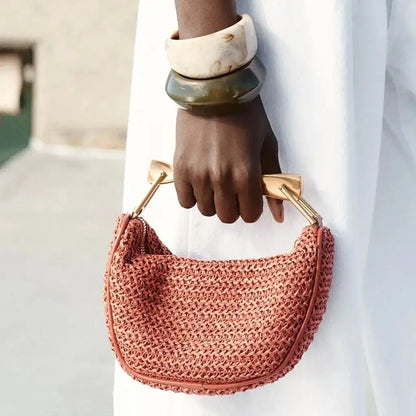 woven straw bucket bag, Sculpted handle bag for working moms, terracotta shoulder bag, work-appropriate summer tote bag, compact woven bag for essentials.